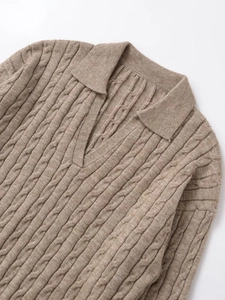 Detailed cable knit texture of khaki V-neck polo sweater with soft wool blend fabric