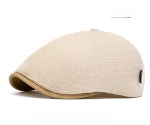 Detailed view of beige mesh ivy cap with breathable fabric and dark camel brim contrast