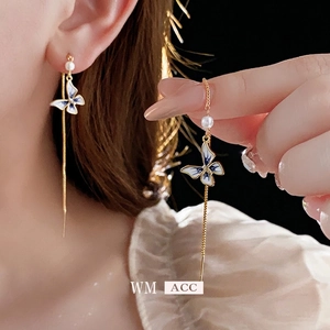 Elegant 14K gold plated butterfly tassel earrings featuring blue accents and pearls