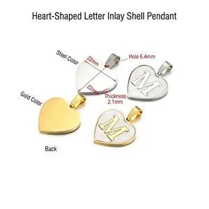 Gold and silver heart pendants with white shell inlay and M letter engraving