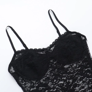 Detailed view of black floral lace dress with adjustable straps and bow decoration