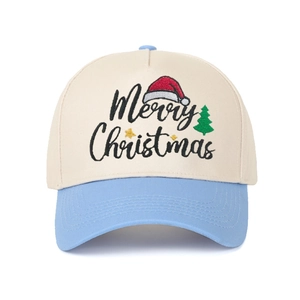 Detailed close-up of Merry Christmas embroidery on a two-tone beige and blue trucker hat