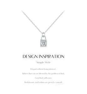 Macro detail of a square lock pendant featuring a brilliant round-cut moissanite stone