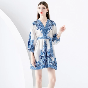 Blue and white floral mini dress with V-neck, waist tie, and elegant puff lantern sleeves
