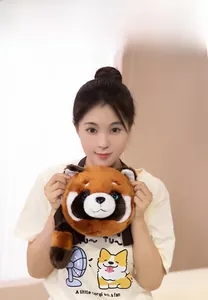 Detail of red panda plush crossbody bag with adjustable black shoulder strap on model