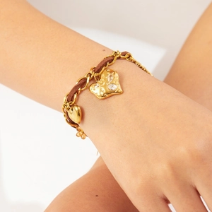 Vintage gold-plated stainless steel chain bracelet with crystal heart pendants on wrist