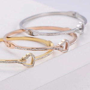 Three-color heart-shaped titanium steel bangles with pavé set crystals in gold and silver