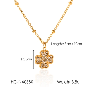 Detailed view of gold clover necklace with zircon inlay and product measurements