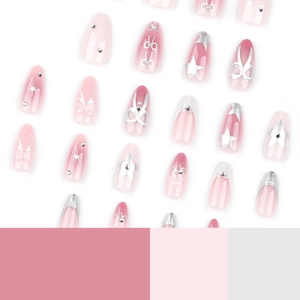 Almond press-on nails with pink gradient, silver stars, and 3D bow decorations