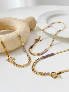 Detail of stainless steel snake chain necklaces with colorful zircon and OT buckle