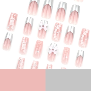 Pink gradient press-on nails with 3D bows, silver French tips and pearl accents