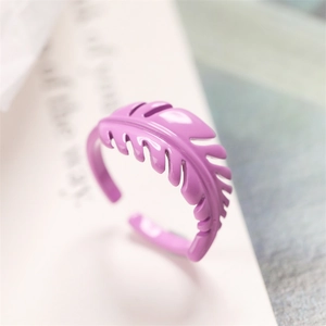 Detailed close-up of a purple enamel leaf-shaped open ring with a glossy finish