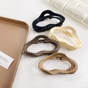 Matte oversized hollow cloud hair claws in black, beige, and brown for thick hair