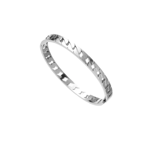 Macro shot of silver stainless steel bangle featuring geometric chain patterns and polished finish