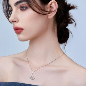 Elegant S925 silver necklace featuring a dancing skirt pendant with pavé set crystals
