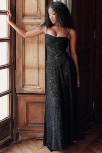 Detailed view of the intricate black lace floral texture on this slim fit evening maxi dress