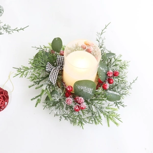 Christmas candle wreath with pine needles red berries and LED candle in glass holder