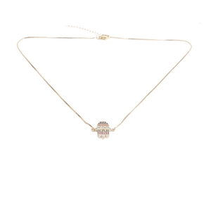 Detail of gold chain necklace featuring a colorful Hamsa hand pendant with micro zircon stones
