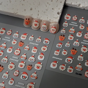 5D embossed Christmas nail art stickers featuring Santa, reindeer and snowman patterns