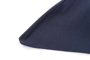 Detailed close-up of precise stitching and navy blue fabric on a strapless tube top
