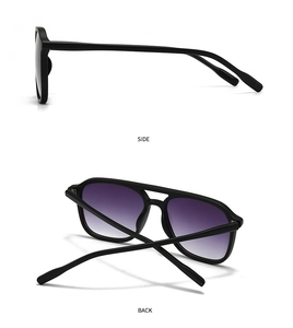 Detail view of square double-bridge sunglasses with black frame and purple gradient lenses
