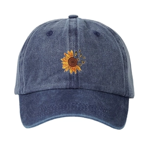 Blue washed denim baseball cap featuring colorful sunflower and butterfly embroidery
