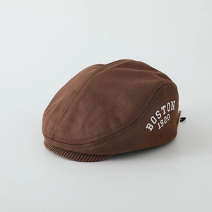 Detail of coffee brown kids beret with white BOSTON 1920 embroidery on suede fabric