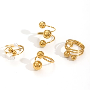 18K gold plated stainless steel spiral rings featuring geometric spheres and pearls