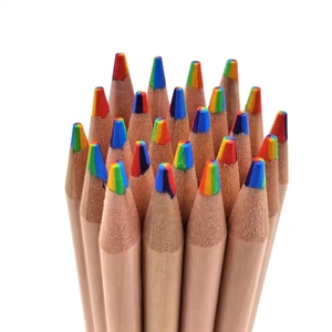 Close-up of rainbow colored multi-color wooden pencils with sharp tips on white background