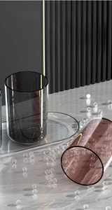 Detail of food-grade PET bathroom organizer set with grey and amber transparent cups