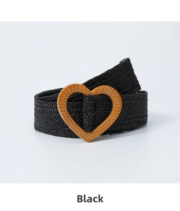 Detailed close-up of a black elastic woven belt featuring a textured heart-shaped buckle