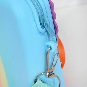 Detailed close-up of sky blue silicone bag with durable metal zipper and strap buckle