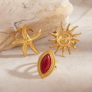 Three-piece gold titanium steel ring set with red agate stone and starfish design