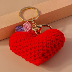 Knitted heart keychain with red, pink, and purple flowers on gold metal ring