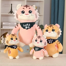 Group display of plush tiger dolls in pink and orange colors with Lucky scarves