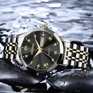 Luxury waterproof men's watch with black dial and silver-gold steel band on water surface