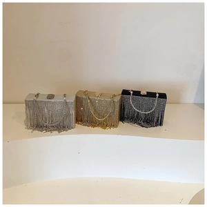 Detailed luxury evening bags featuring rhinestone tassels and elegant pearl handles
