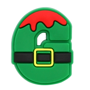 Detail view of the letter G PVC shoe charm with Santa Claus belt and Christmas elf colors