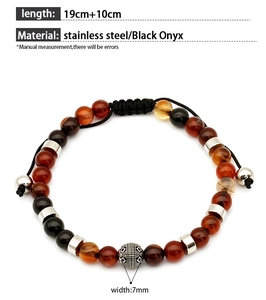 Detail of beaded bracelet with black onyx, stainless steel spacers and silver metal bead