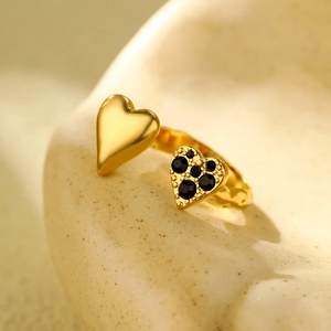 Adjustable gold heart ring featuring black zircon stones and textured metal finish