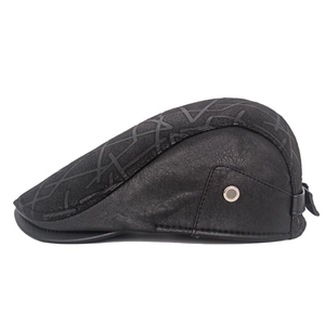 Detail of premium leather and textured fabric patchwork on a warm men's winter flat cap