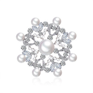 Detailed close-up of blue flower brooch with silver alloy pearls and sparkling crystals