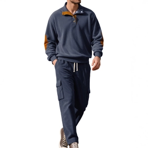 Detail of dark blue corduroy Henley shirt with brown elbow patches and cargo pants