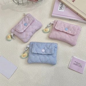 Quilted fabric mini wallets with heart stitching and cute bear charms in three colors