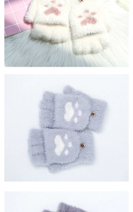 Detail of plush cat paw flip top gloves in white and gray with fuzzy texture