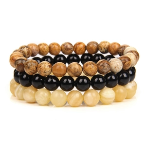 Detailed stack of three 6mm beaded bracelets featuring map stone, black beads, and agate
