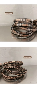 Detail of high elasticity hair ties in classic leopard print and elegant plaid patterns