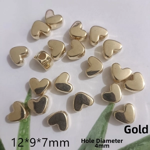 Detail showing 12x9x7mm golden heart-shaped beads with 4mm large hole for DIY jewelry