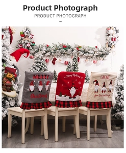 Three Christmas gnome chair covers with plaid ruffles shown in a cozy festive room setting
