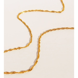 Vintage golden ginkgo leaf pendant necklace with elegant water wave chain for women